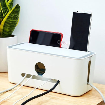 cache pour fil electrique sur table plante téléphones