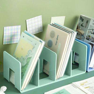 cale pour livre verte avec compartiments plusieurs livres chacun