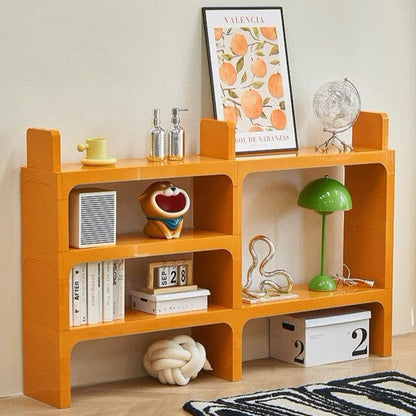 Étagère bureau orange avec décoration lampe boîte cadre