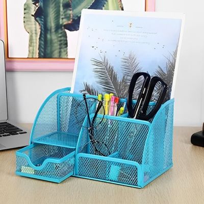 organiseur pour bureau bleu document dedans et fourniture sur bureau