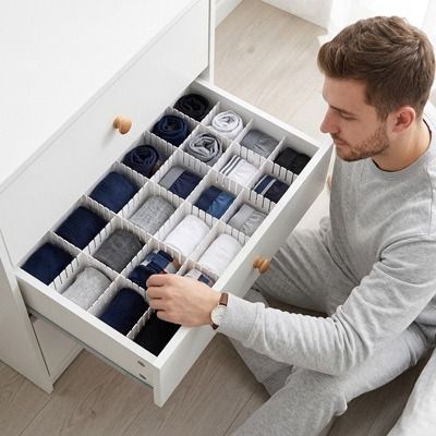 séparateur de tiroir homme assis tiroir ouvert boxers triés